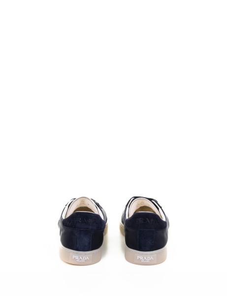 Navy blue sneakers with logo