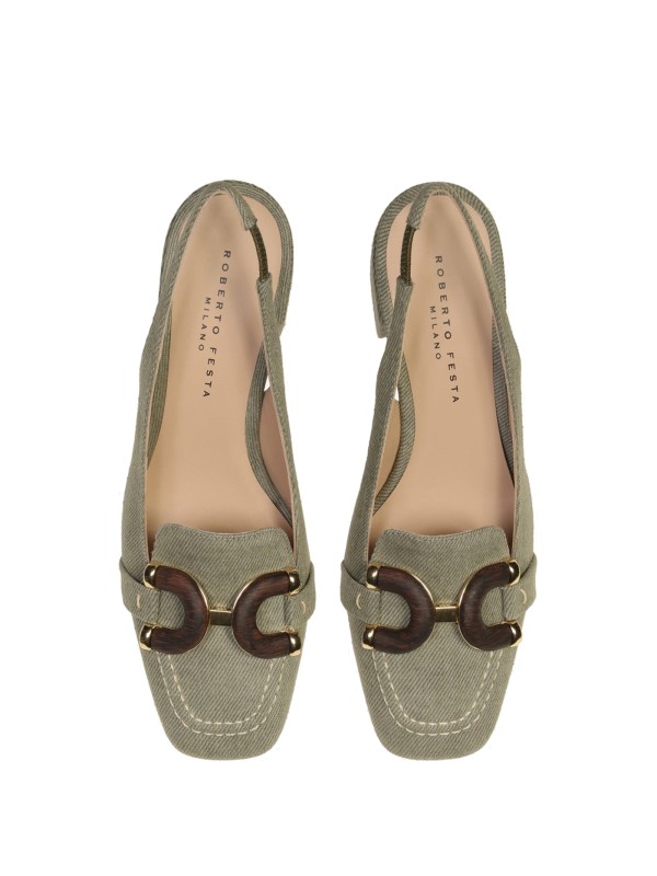 Chanel slingback in khaki jeans with wooden accessory