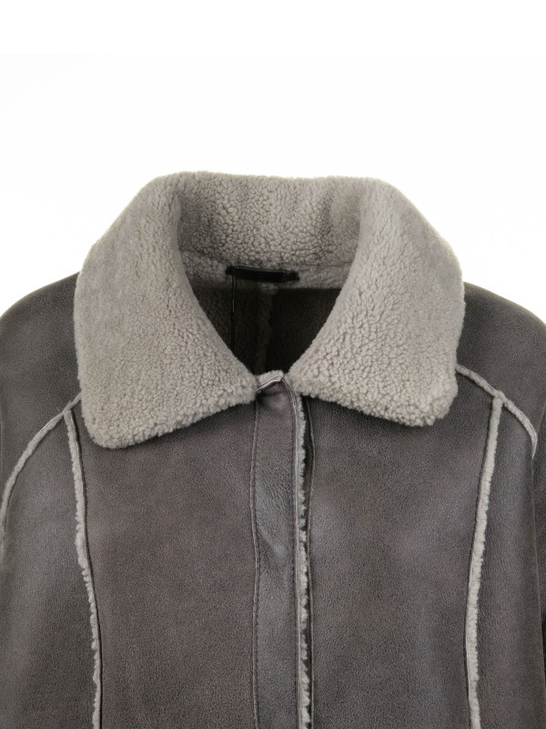 Long coat in sheepskin and curly wool