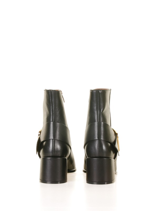 Leather ankle boot with golden buckle