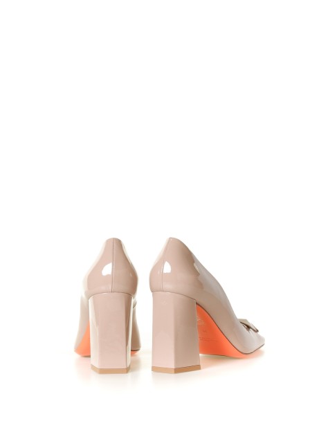 Pink leather pumps with accessory