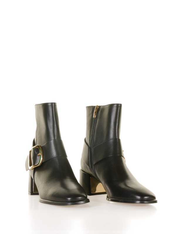 Leather ankle boot with golden buckle